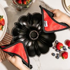 Alternative view of Lodge Castiron - Cast Iron Fluted Cake Pan with Red Potholders